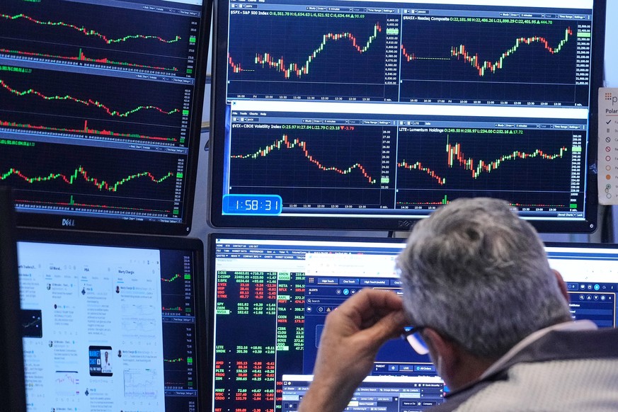 A trader works on the floor of the New York Stock Exchange, Friday, Nov. 21, 2025. (AP Photo/Richard Drew)
Financial Markets Wall Street