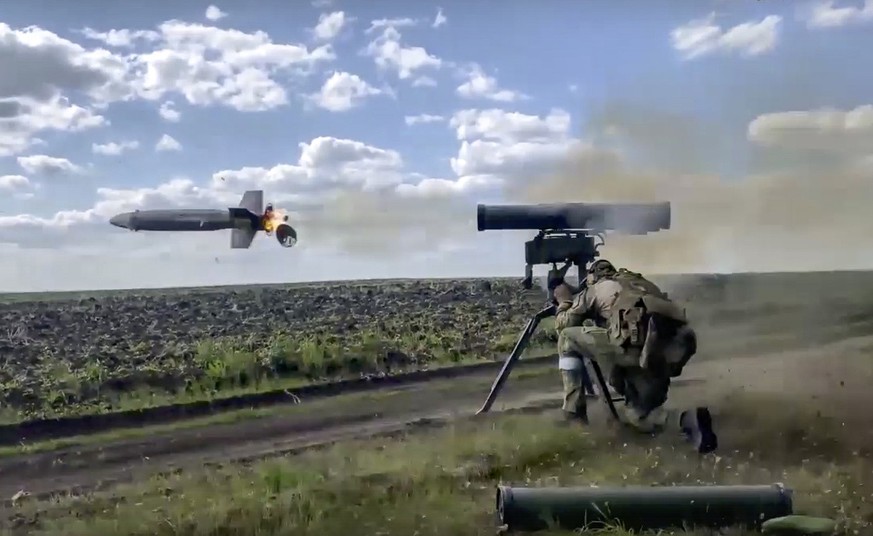 In this handout photo taken from video released by Russian Defense Ministry Press Service on Monday, Aug. 29, 2022, a Russian soldier fires from a Kornet, a Russian man-portable anti-tank guided missi ...