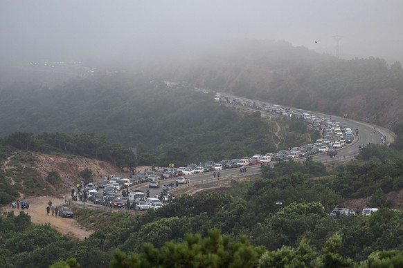 epaselect epa13142938 Police set up a roadblock on the outskirts of Fnideq, near Morocco's border with the Spanish enclave of Ceuta, 30 July 2026. Hundreds of people headed toward the border afte ...
