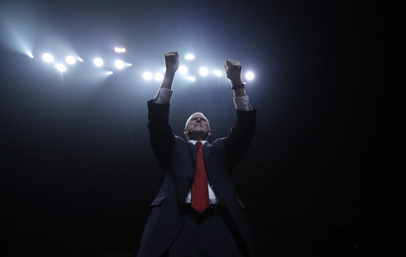 Republican vice presidential candidate, Indiana Gov. Mike Pence, takes the stage to speak to a campaign rally before the arrival of Republican presidential candidate Donald Trump, Monday, Nov. 7, 2016 ...