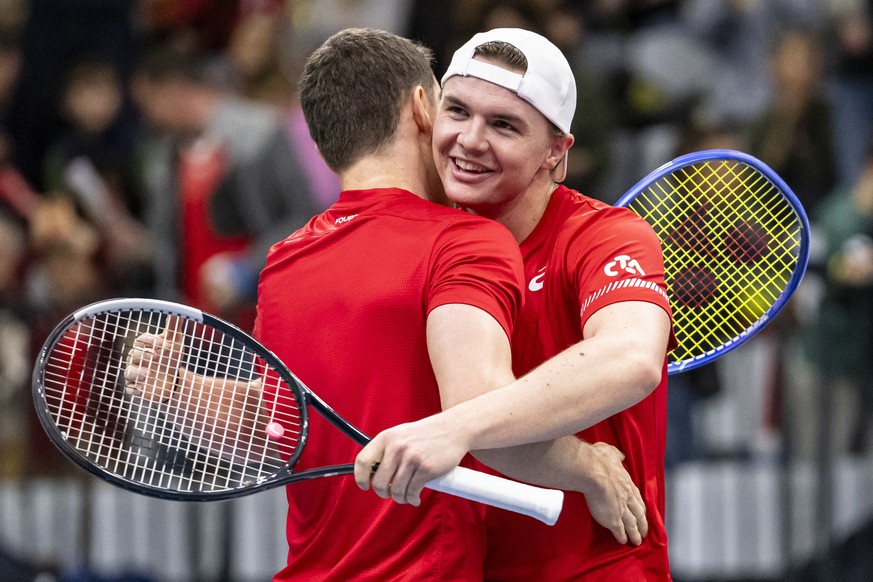 epa12712850 Switzerland's Jakub Paul, left, and Dominic Stricker, right, celebrate after winning against Tunisia's Moez Echargui and Skander Mansouri in the men's doubles match of the D ...