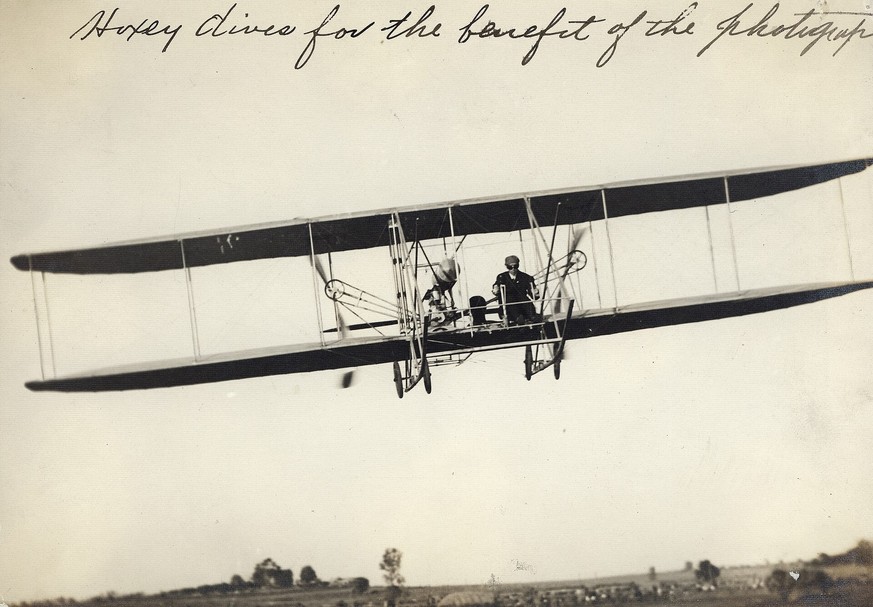 Title: &amp;quot;Hoxey [sic] dives for the benefit of the photographer.&amp;quot; Arch Hoxsey in a Wright Flyer Model B at the International Air Meet, Kinloch Field. October 1910. 
https://en.wikipedi ...