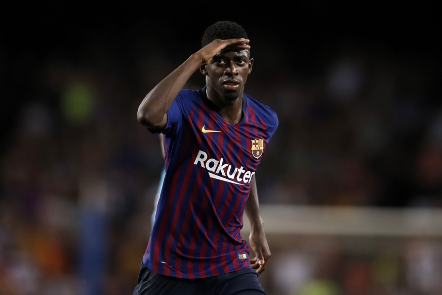 Barcelona forward Ousmane Dembele celebrates after scoring his side&#039;s second goal during the group B Champions League soccer match between FC Barcelona and PSV Eindhoven at the Camp Nou stadium i ...