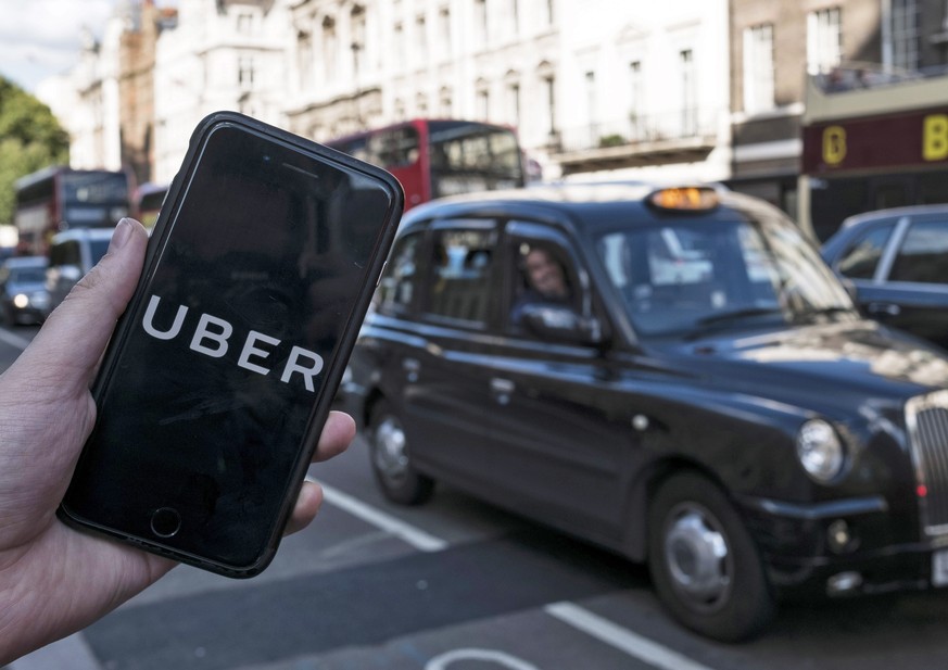 epa09023555 (FILE) - An image showing an Uber app on a mobile phone in central London, Britain, 22 September 2017 (re-issued 19 February 2021). The UK Supreme Court on 19 February 2021 ruled the Uber  ...