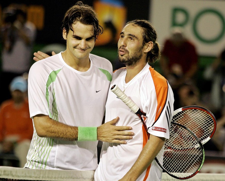 Switzerland&#039;s Roger Federer, left, is congratulated by Cypriot Marcos Baghdatis after winning the men&#039;s singles final at the Australian Open tennis tournament in Melbourne, Australia, Sunday ...