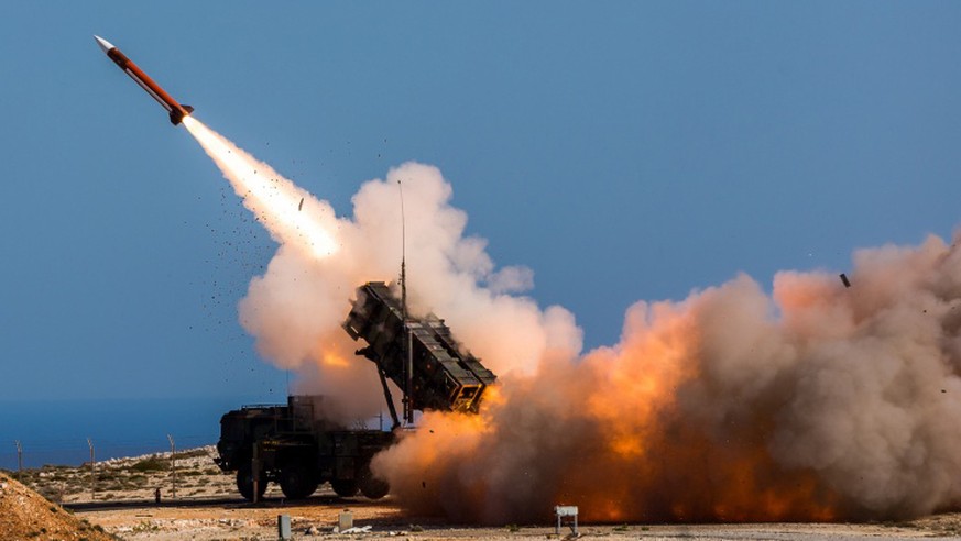 FILE - In this image released by the U.S. Department of Defense, German soldiers assigned to Surface Air and Missile Defense Wing 1, fire the Patriot weapons system at the NATO Missile Firing Installa ...