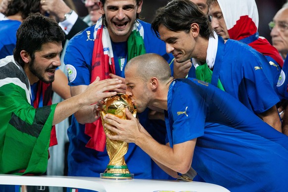 Alessandro Del Piero of Italy kissing the World Cup Trophy. World Cup Final match between France (1) and Italy (1). Italy would win on penalties (5) to (3) at the Olympiastadion on July 09, 2006 in Be ...