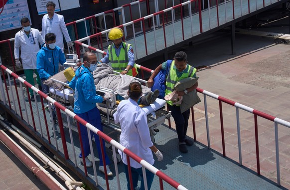 Medics take Dawa Sherpa, a mountain guide who had been missing for several days in the Everest region, for treatment after he arrived at HAMS Hospital in Kathmandu, Nepal, Thursday, June 4, 2026. (AP  ...