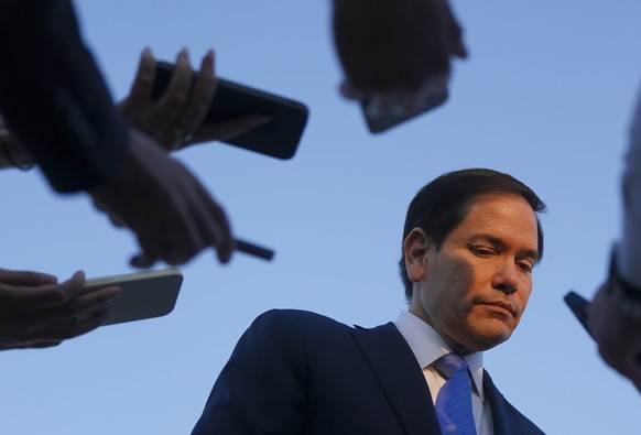 U.S. Secretary of State Marco Rubio listens as he speaks to media at Ben Gurion International Airport, as he departs Tel Aviv for Qatar following an official visit, near Lod, Israel, Tuesday, Sept. 16 ...