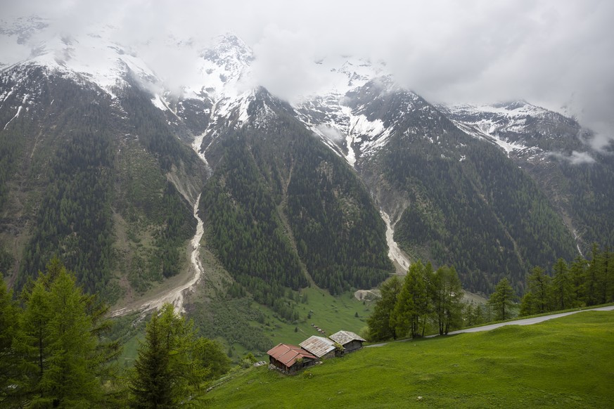 epa12119968 An alp above the village of Wiler, Switzerland, 20 May 2025. The village of Blatten VS in the Loetschental valley had to be completely evacuated due to the danger of a rockfall. Around 300 ...