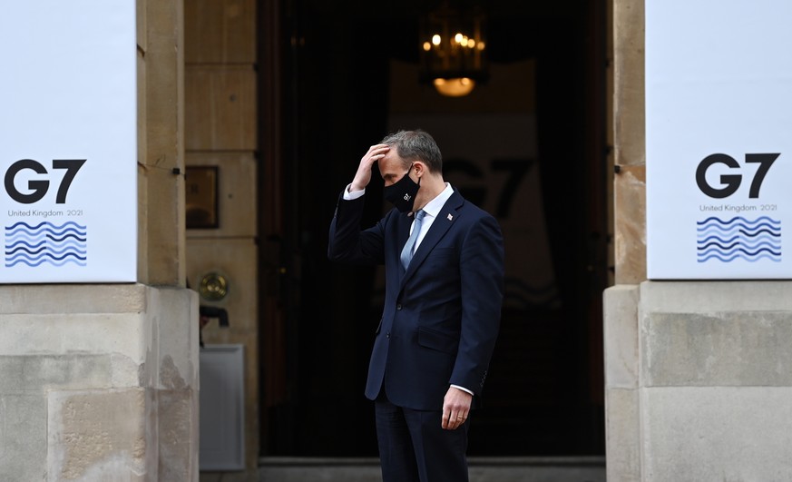 epa09178519 British Foreign Secretary Dominic Raab awaits the arrivals of delegates to the G7 Foreign Ministers meeting at Lancaster House in London, Britain, 05 May 2021. Foreign Ministers from the w ...