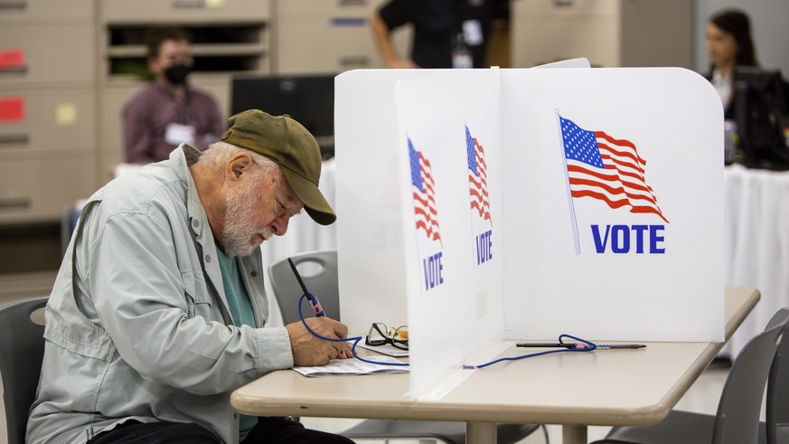 FILE - Voters cast their ballots on Sept. 23, 2022, in Minneapolis. The upcoming midterm elections could give the stock market a sorely needed boost by eliminating at least some of the uncertainty tha ...