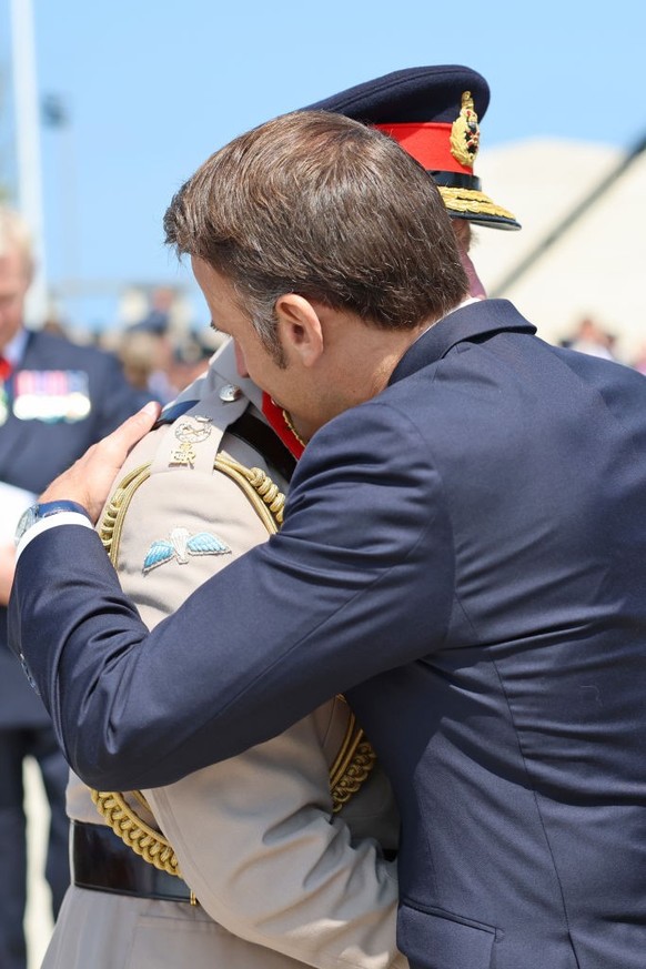 VER-SUR-MER, FRANCE - JUNE 06: King Charles III and President of France, Emmanuel Macron laugh during the UK Ministry of Defence and the Royal British Legion’s commemorative event at the British Norma ...
