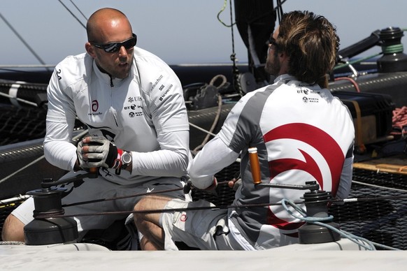 Swiss members of the Swiss defender Alinghi Yves Detrey, left, and Nils Frei, right, sail during a training session on a Xtreme 40 catamaran, in Valencia, eastern Spain, Thursday, April 24, 2008. Afte ...