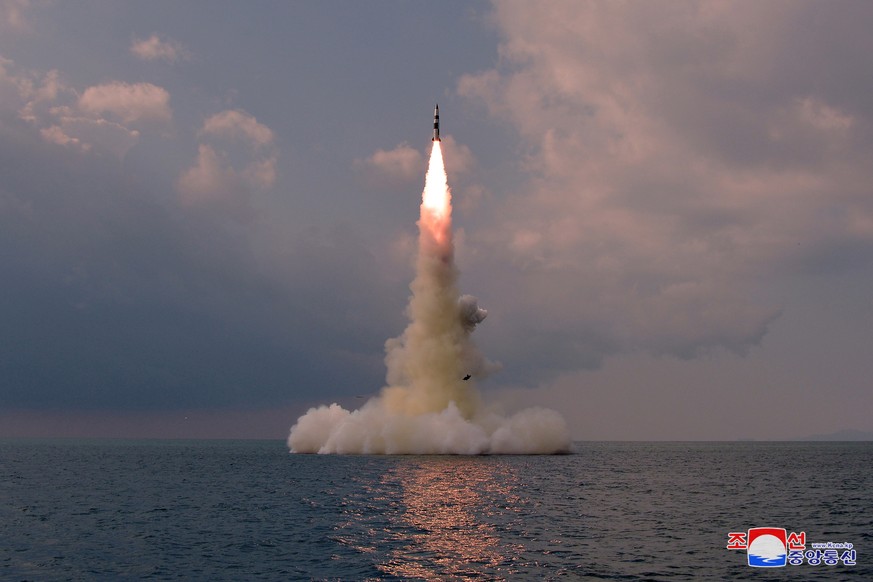 epa09533319 A photo released by the official North Korean Central News Agency (KCNA) shows the Academy of Defence Science of the DPRK test-firing a new type submarine-launched ballistic missile at an  ...