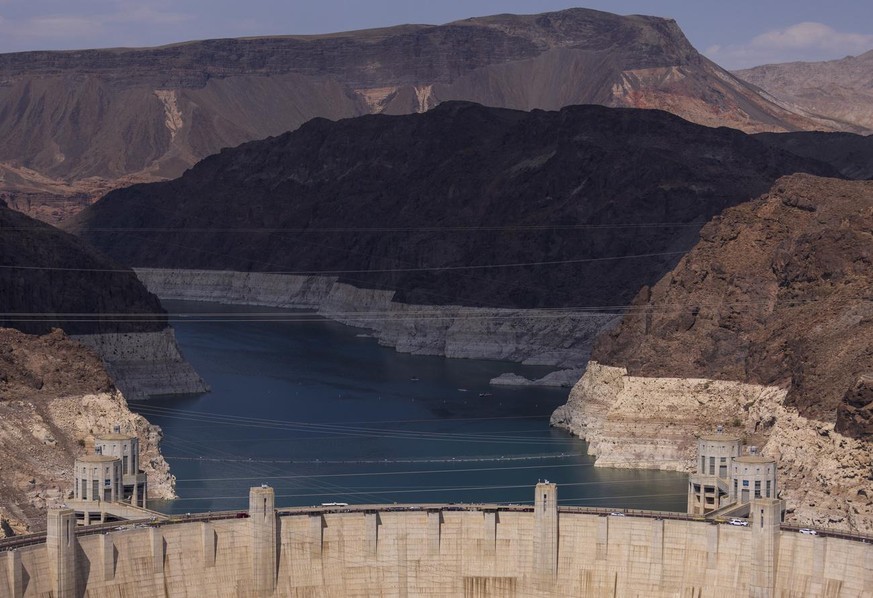 epa09287574 A view of the white ring of mineralized stone indicating the drop in water levels near the Hoover Dam at Lake Mead National Recreation Area in Boulder City, Nevada, USA, 19 June 2021. Lake ...