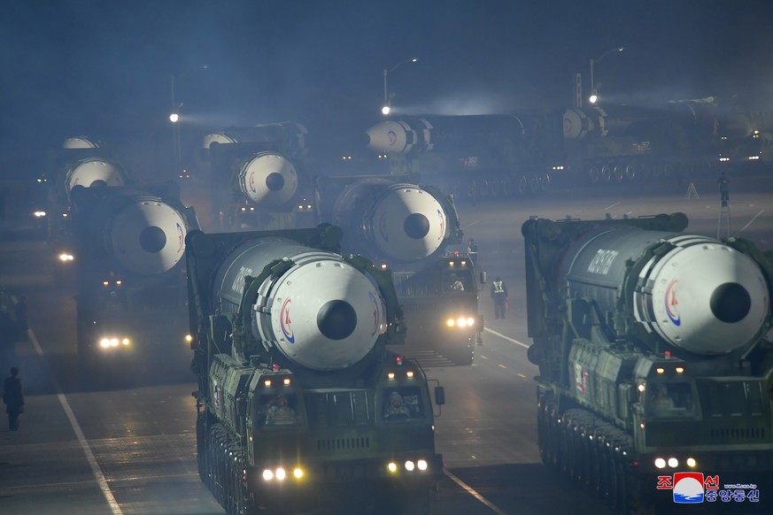 epa10455995 A photo released by the official North Korean Central News Agency (KCNA) shows Hwasong-17 intercontinental ballistic missiles displayed during a military parade at Kim Il Sung Square to ma ...