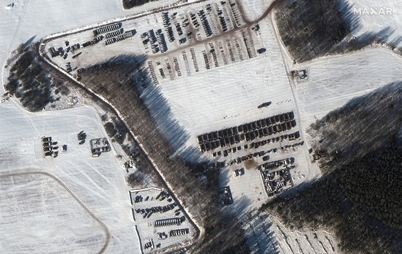 This satellite images provided by Maxar Technologies shows a troop housing area and vehicle park in Rechitsa, Belarus, Friday, Feb. 4, 2022. Russia has moved troops from Siberia and the Far East to Be ...
