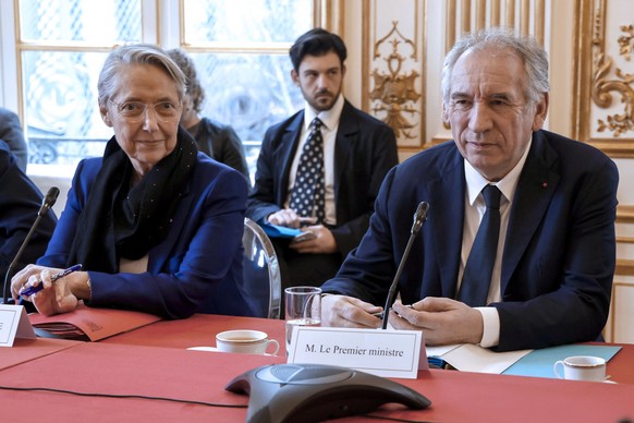 epa11925619 France&#039;s Prime Minister Francois Bayrou (R) sits next to France&#039;s Minister of National Education, Higher Education and Research Elisabeth Borne (L) before chairing a meeting of t ...