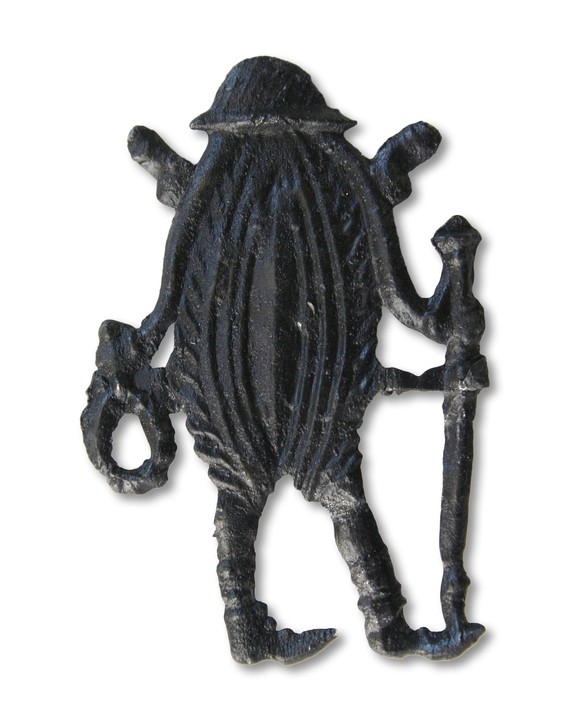 Vulve habillée en pèlerine tenant un chapelet dans une main et un bâton de pèlerin dans l’autre.
https://database.kunera.nl/en/collectie-object/6e3bac12-6ffb-4b7d-bf4d-d79db7515e1a