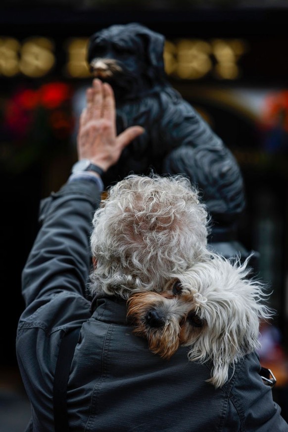 EDINBURGH, SCOTLAND - JULY 24: Members of the Dandie Dinmont Terrier Club gather at the statue of Greyfriars Bobby on July 24, 2022 in Edinburgh, Scotland. Mike Macbeth from Canada and Paul Keevil fro ...