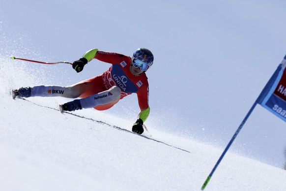 Switzerland&#039;s Marco Odermatt speeds down the course during an alpine ski, men&#039;s World Cup super-G race, in Saalbach, Austria, Friday, March 22, 2024. (AP Photo/Marco Trovati)
