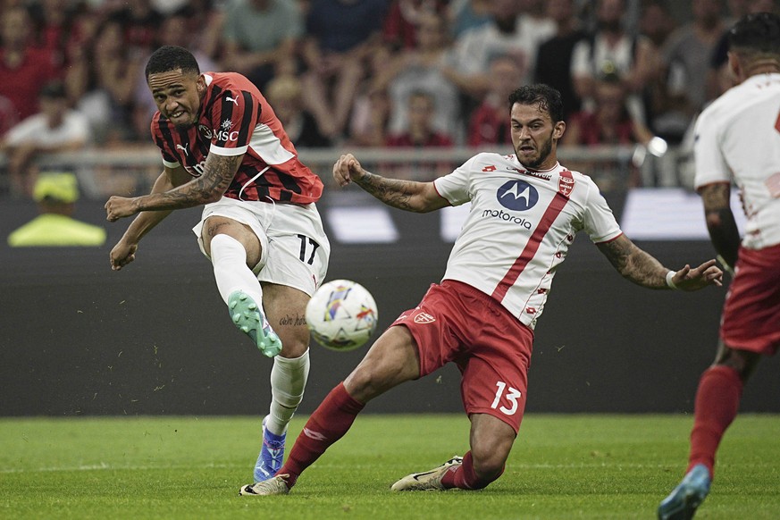 AC Milan&#039;s Noah Okafor, left, shoots at goal as Monza&#039;s Pedro Pereira defends during the Silvio Berlusconi Trophy (Trofeo Berlusconi) soccer match at the San Siro Stadium in Milan, Italy, Tu ...