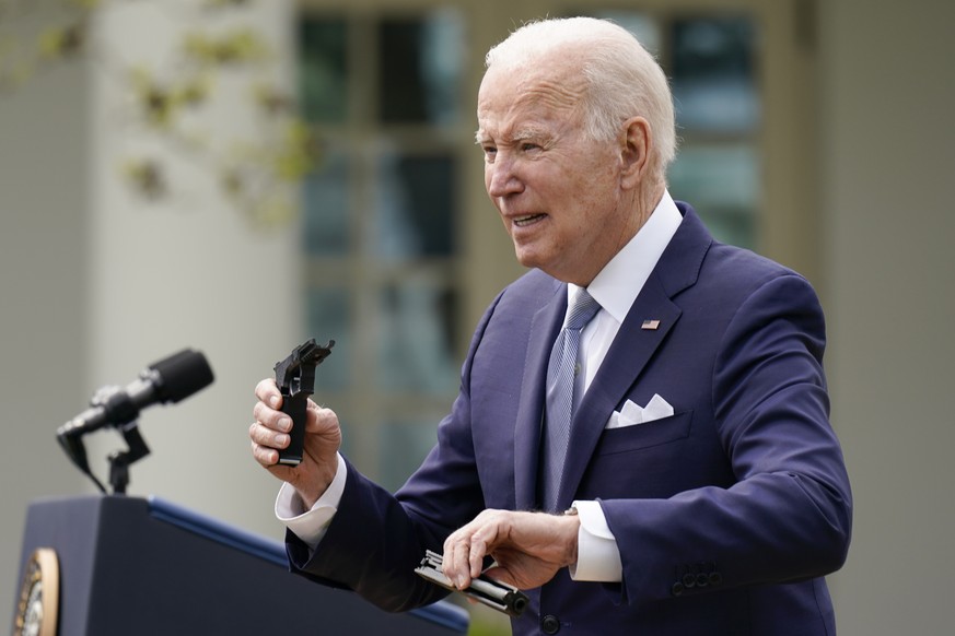 President Joe Biden holds pieces of a 9mm pistol as he speaks in the Rose Garden of the White House in Washington, Monday, April 11, 2022. Biden announced a final version of the administration&#039;s  ...