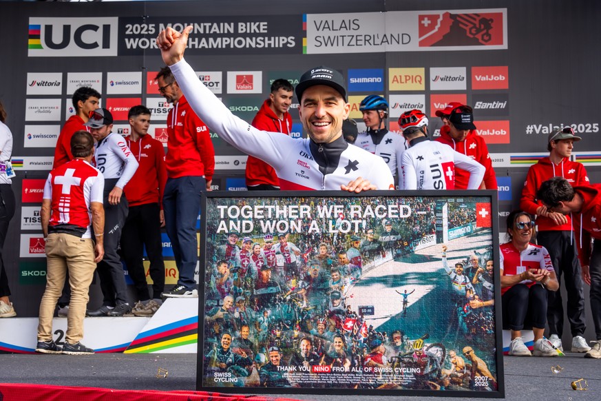 Nino Schurter of Switzerland, celebrates his last MTB XCO World Championships and the end of his career at the end of 2025, with the Swiss Cycling staff, his fellow cyclists, his coach after the UCI M ...