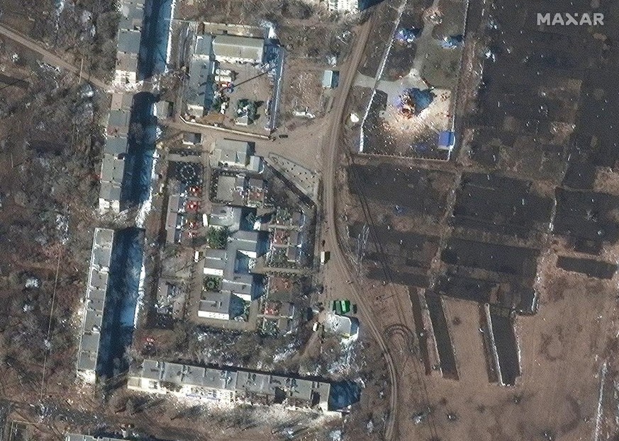 This satellite image provided by Maxar Technologies shows destroyed apartment buildings and a church after the Russian invasion, in Sumy, Ukraine, Monday, March 14, 2022. (Satellite image ©2022 Maxar  ...