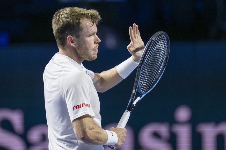 Switzerland&#039;s Remy Bertola cheers after winning his qualifying match against France&#039;s Adrian Mannarino at the Swiss Indoors tennis tournament at the St. Jakobshalle in Basel, Switzerland, on ...