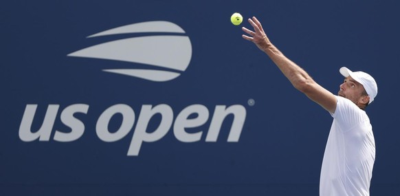 epa09437310 Ivo Karlovic of Croatia serves to Andrey Rublev of Russia during their match on the first day of the US Open Tennis Championships the USTA National Tennis Center in Flushing Meadows, New Y ...