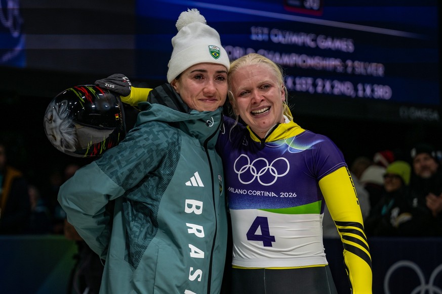 CORTINA D'AMPEZZO, ITALY - FEBRUARY 14: Nicole Rocha Silveira of Team Brazil and Kim Meylemans of Team Belgium in the finish after the Women's Skeleton Heat Four on day eight of the Milano C ...