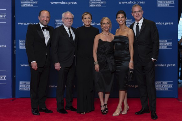 From left; Phil Rucker, Wolf Blitzer, Pamela Brown, Dana Bash, Kaitlan Collins and Jeff Zeleny pose for photographers as they arrive at the annual White House Correspondents&#039; Association Dinner i ...