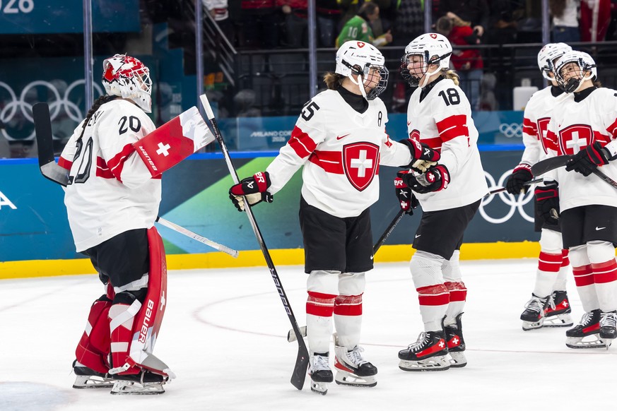 Switzerland's goaltender Andrea Braendli #20, Switzerland's Alina Muller #25, Switzerland's Stefanie Wetli #18 and Switzerland's Nicole Vallario, right, look disappointed after los ...