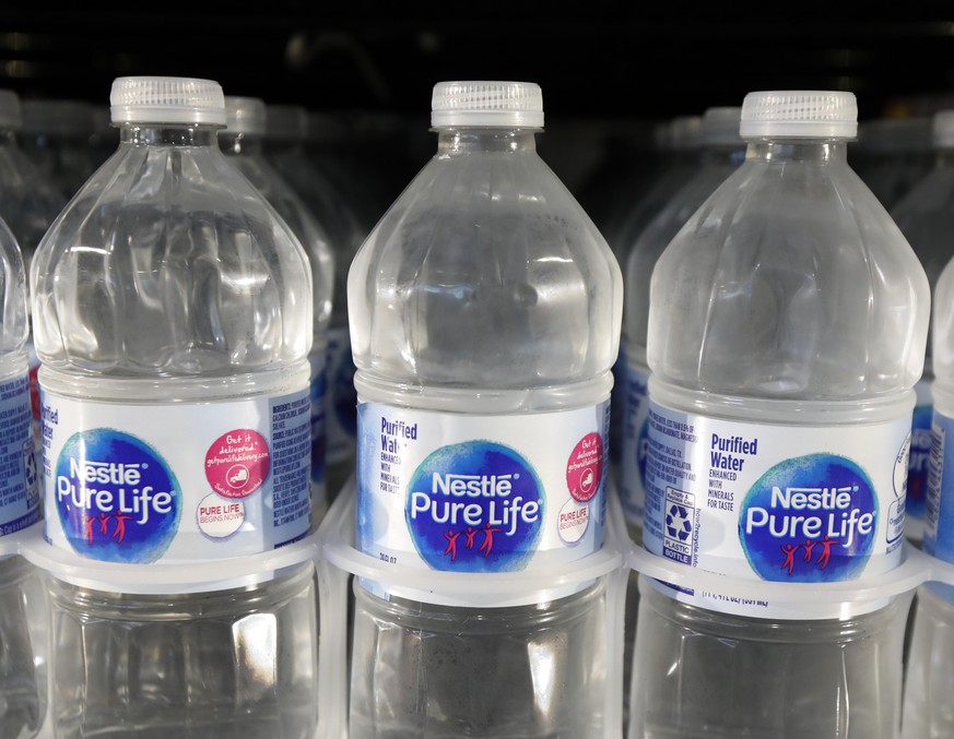 FILE - In this Sept. 21, 2018, file photo, is a closeup of pint bottles of purified water, Pure Life, manufactured by Nestle, on sale in a Ridgeland, Miss., convenience store. Global food giant Nestle ...