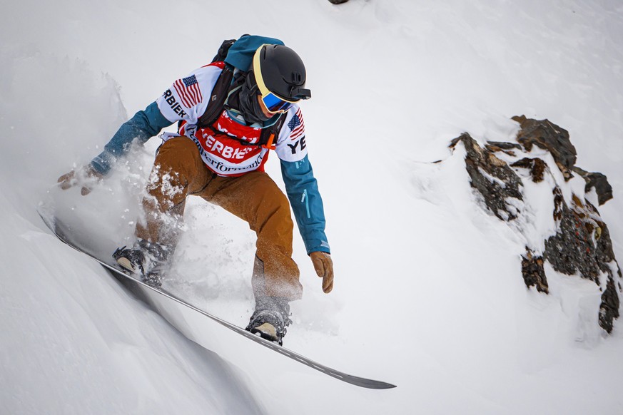 Snowboarder Jonathan Penfield from the U.S. competes to win the first place of the mens swnoboard category at the Verbier Xtreme Freeride World Tour (FWT) finals on the "Bec des Rosses" moun ...