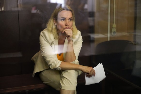Marina Ovsyannikova, a former Russian state TV journalist who quit after making an on-air protest of Russia's military operation in Ukraine, listens sitting in a court room during a hearing in Mo ...