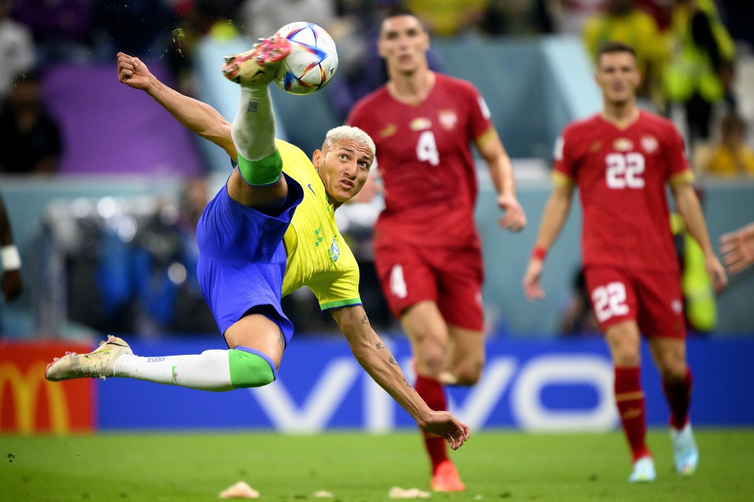 Brazil's forward Richarlison, left, scores the second goal for his team in front of Serbia's defender Nikola Milenkovic, center, and Serbia's midfielder Darko Lazovic, right, during the FIFA World Cup ...