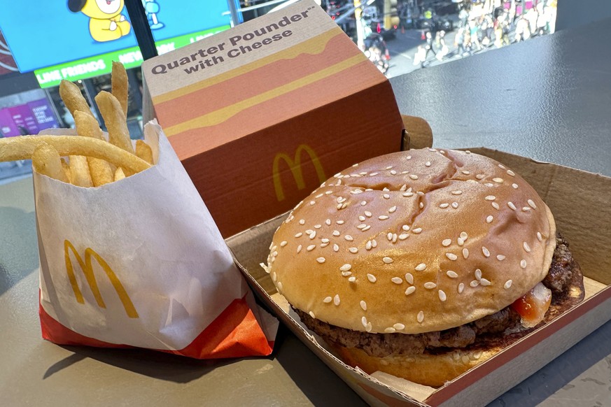 A McDonald&#039;s Quarter Pounder hamburger and fries are shown in this photograph, in New York&#039;s Times Square, Wednesday, Oct. 23, 2024. (AP Photo/Richard Drew)