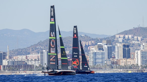 Ineos Britannia&#039;s AC75, left, and Alinghi Red Bull Racing&#039;s AC75 boats sail during a semi-finals America&#039;s Cup Regatta ahead of the 37th America&#039;s Cup sailing race along the Barcel ...