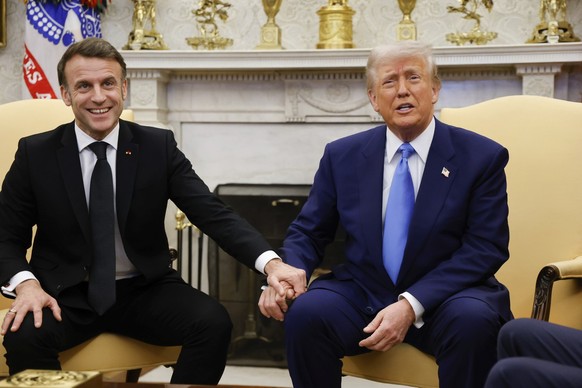 President Donald Trump, right, meets with France's President Emmanuel Macron in the Oval Office of the White House in Washington, Monday, Feb. 24, 2025. (Ludovic Marin/Pool via AP)