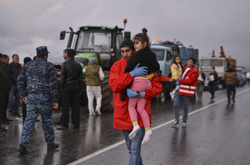 epa10883065 Ethnic Armenians from Nagorno-Karabakh arrive at a registration center of the Armenian Ministry of Foreign Affairs, near the border town of Kornidzor, Armenia, 25 September 2023. Azerbaija ...