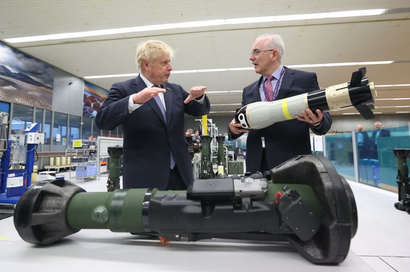 Britain&#039;s Prime Minister Boris Johnson is shown the missile from the inside of an NLAW (Next Generation Light Anti-Tank Weapon) by the Managing Director of Thales Belfast, Philip McBride, at Thal ...