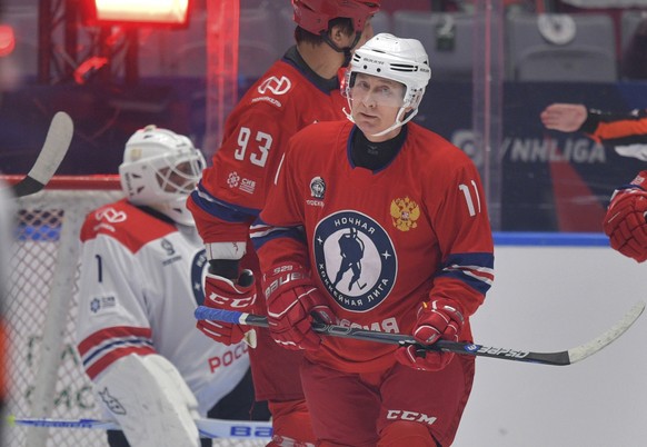 Russian President Vladimir Putin attends a gala match with the participation of Russian hockey legends as part of the final stage of the X All-Russian Night Hockey League festival in the Bolshoi Ice P ...