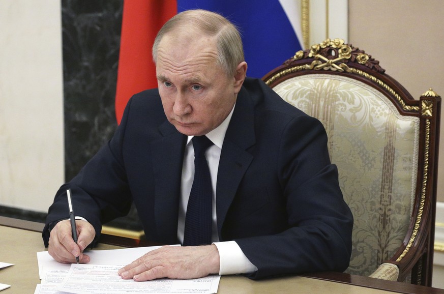 Russian President Vladimir Putin chairs a meeting with members of the government via teleconference in Moscow, Thursday, March 10, 2022. (Mikhail Klimentyev, Sputnik, Kremlin Pool Photo via AP)