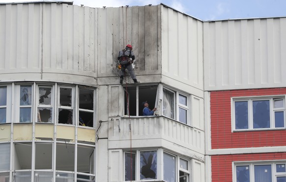 epa10663067 Workers repare a damaged residential building following a reported drone attack in Moscow, Russia, 30 May 2023. An unmanned aerial vehicle (UAV) attack caused &#039;minor&#039; damage to s ...