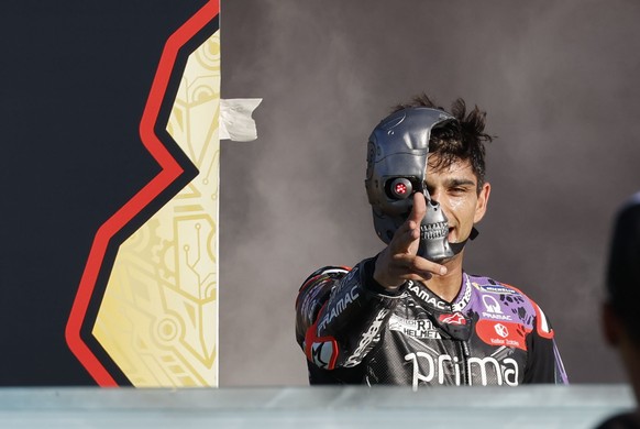 epa11725857 Prima Pramac rider Jorge Martin of Spain celebrates his win of the MotoGP World Championship on the podium after he finished third in the MotoGP race in the Motorcycling Solidarity Grand P ...