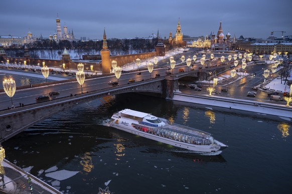 The Kremlin Wall, the Spasskaya Tower, Red Square, the GUM department store, the St. Basil's Cathedral and the Bolshoy Moskvoretsky Bridge are decorated for the New Year and Christmas festivities in M ...
