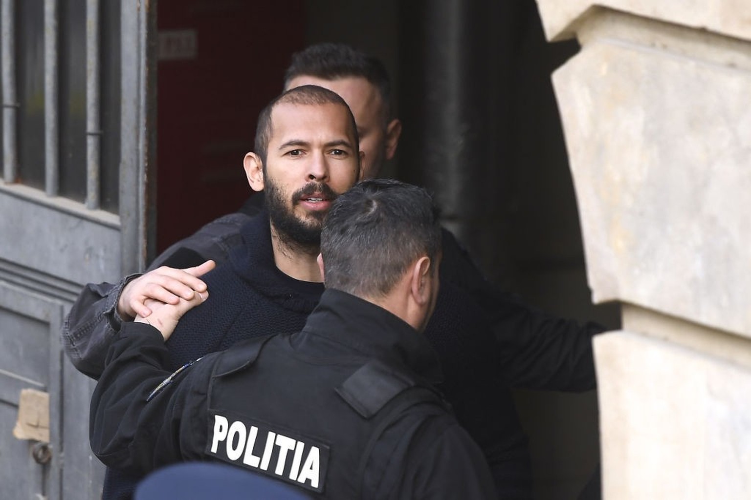 BUCHAREST, ROMANIA - FEBRUARY 01: Former kickboxer Andrew Tate and his brother Tristan arrive in court to attend their appeal in Bucharest, Romania on February 01, 2023. (Photo by Alex Nicodim/Anadolu ...